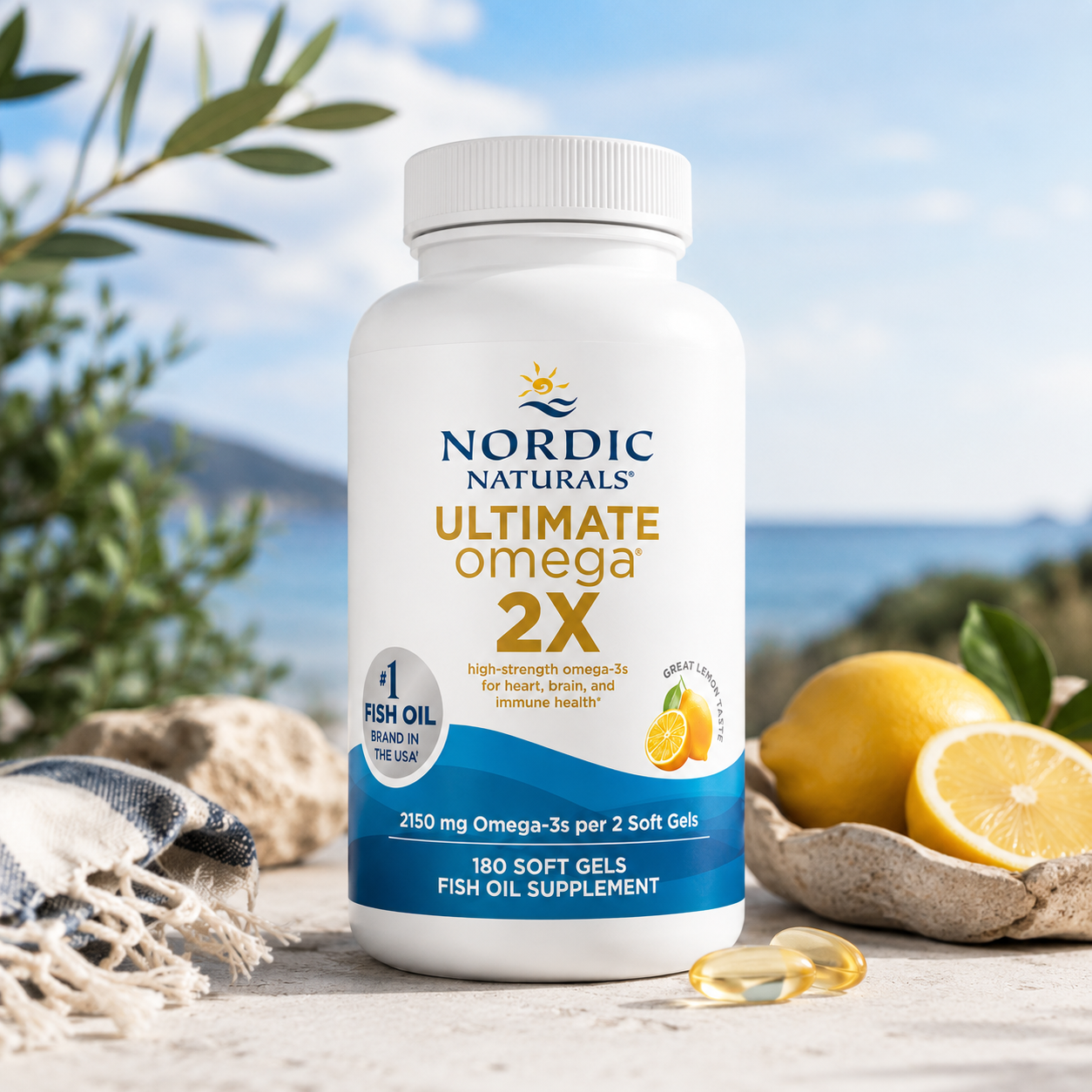  Omega 3 fish oil supplement bottle, 180 soft gels, displayed on a rustic stone surface with lemons, a woven throw, and an outdoor ocean background.